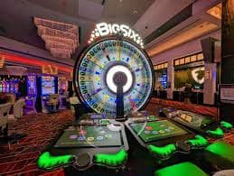 Live dealer at demo judi Casino Hold'em table in studio setting